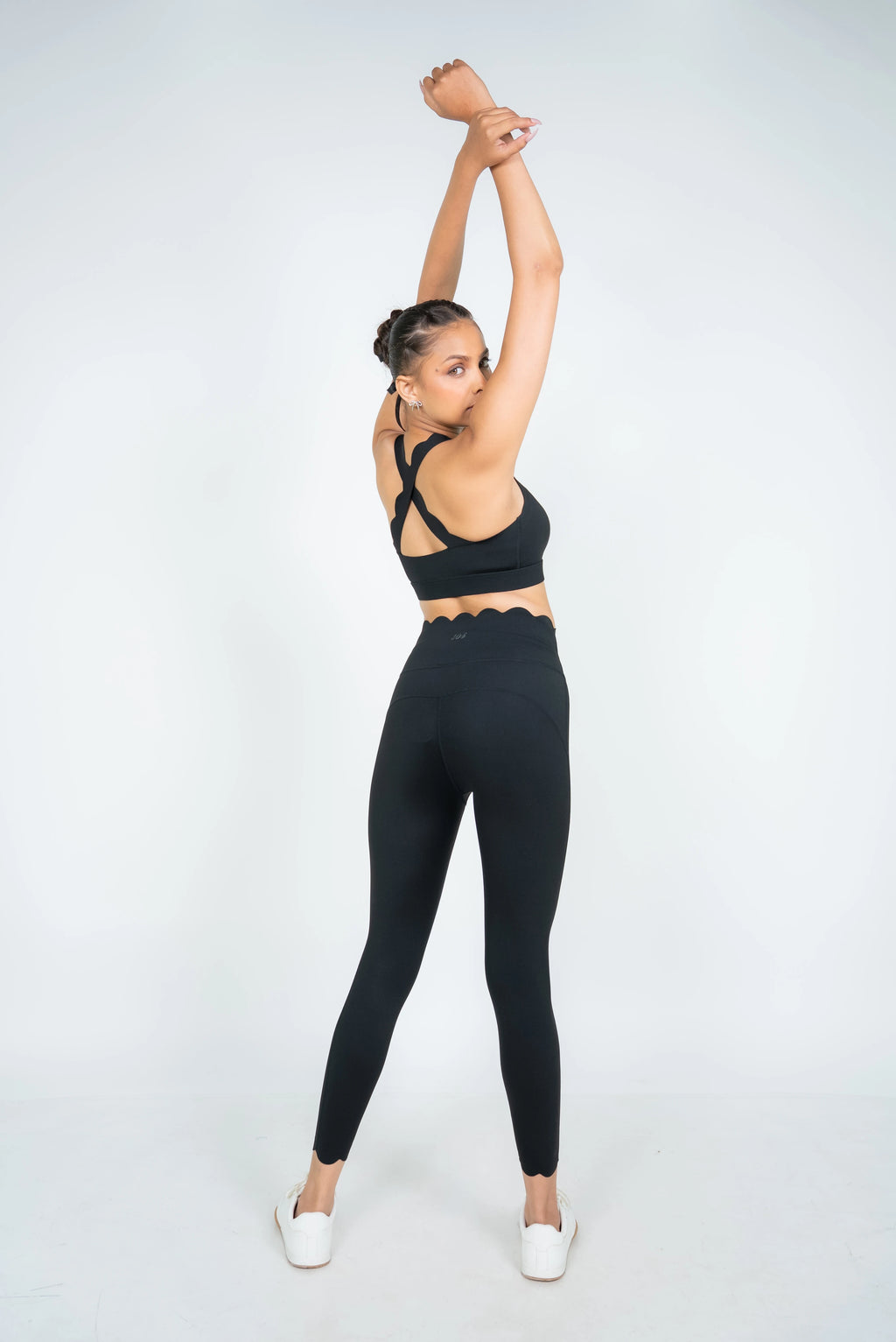 Woman wearing black Soi sculpt core activewear set