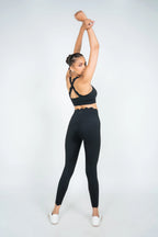 Woman wearing black Soi sculpt core activewear set