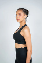 Side profile of Soi sculpt leggings and sports bra