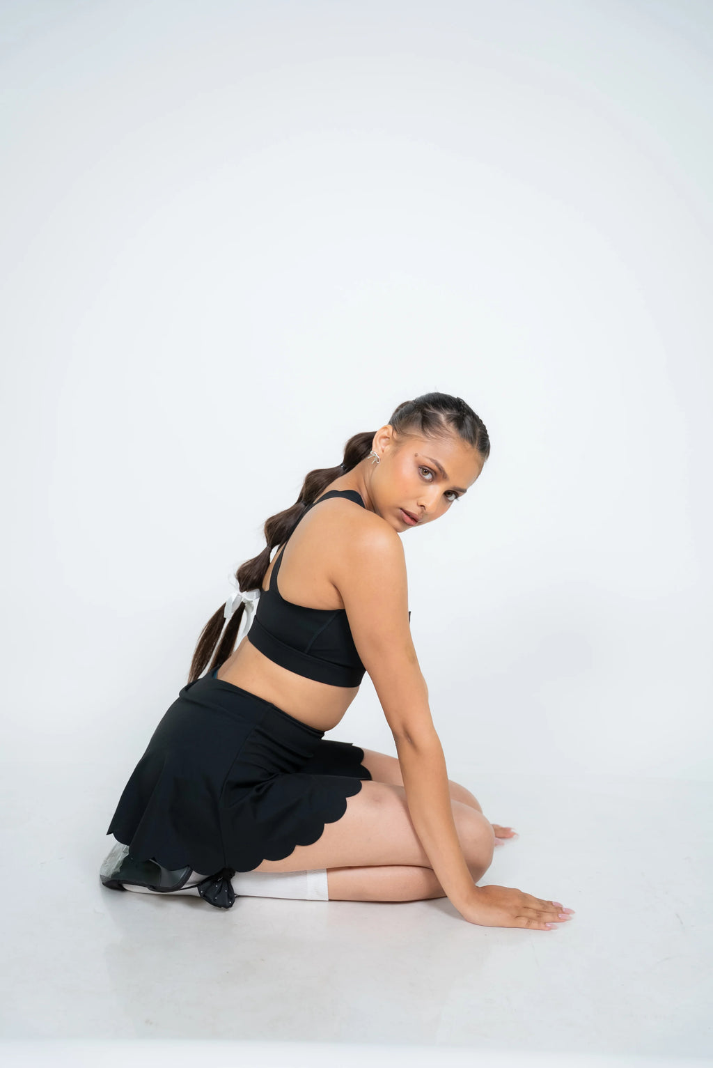 Premium black athleisure skirt with soft flared silhouette