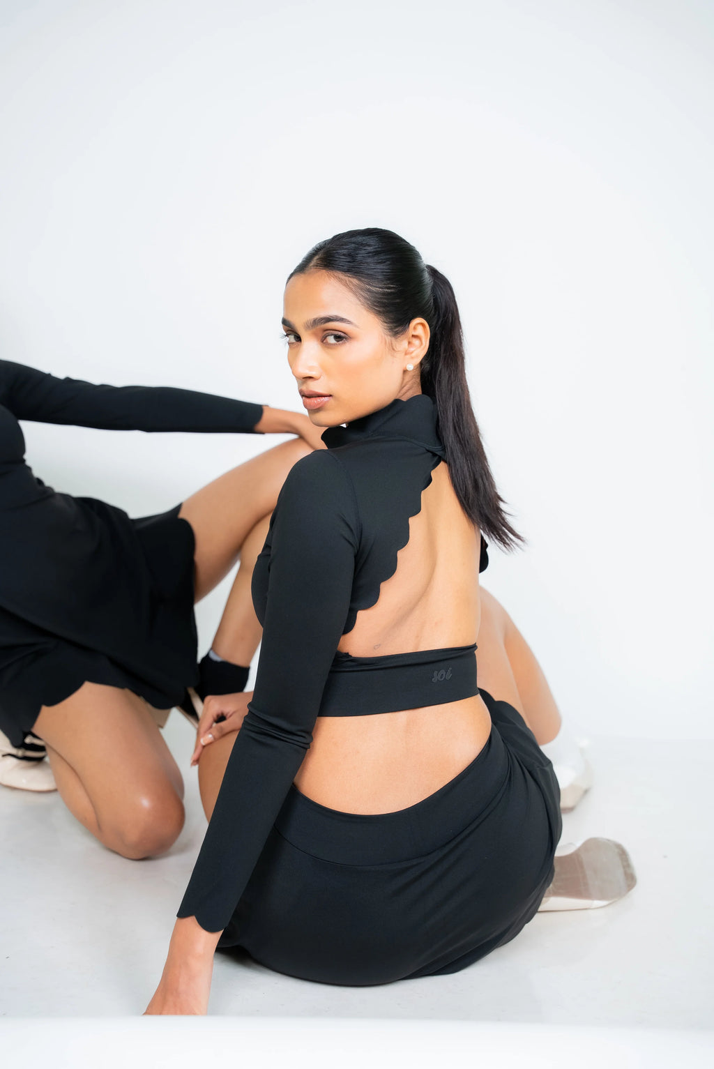 Black scallop hem open back sports top by Soi